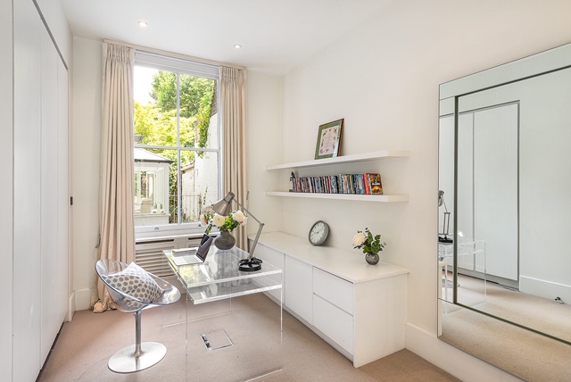 Study area with glass desk and office chair 