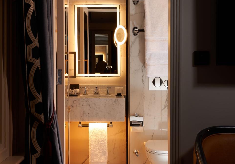 bathroom with uplit mirror
